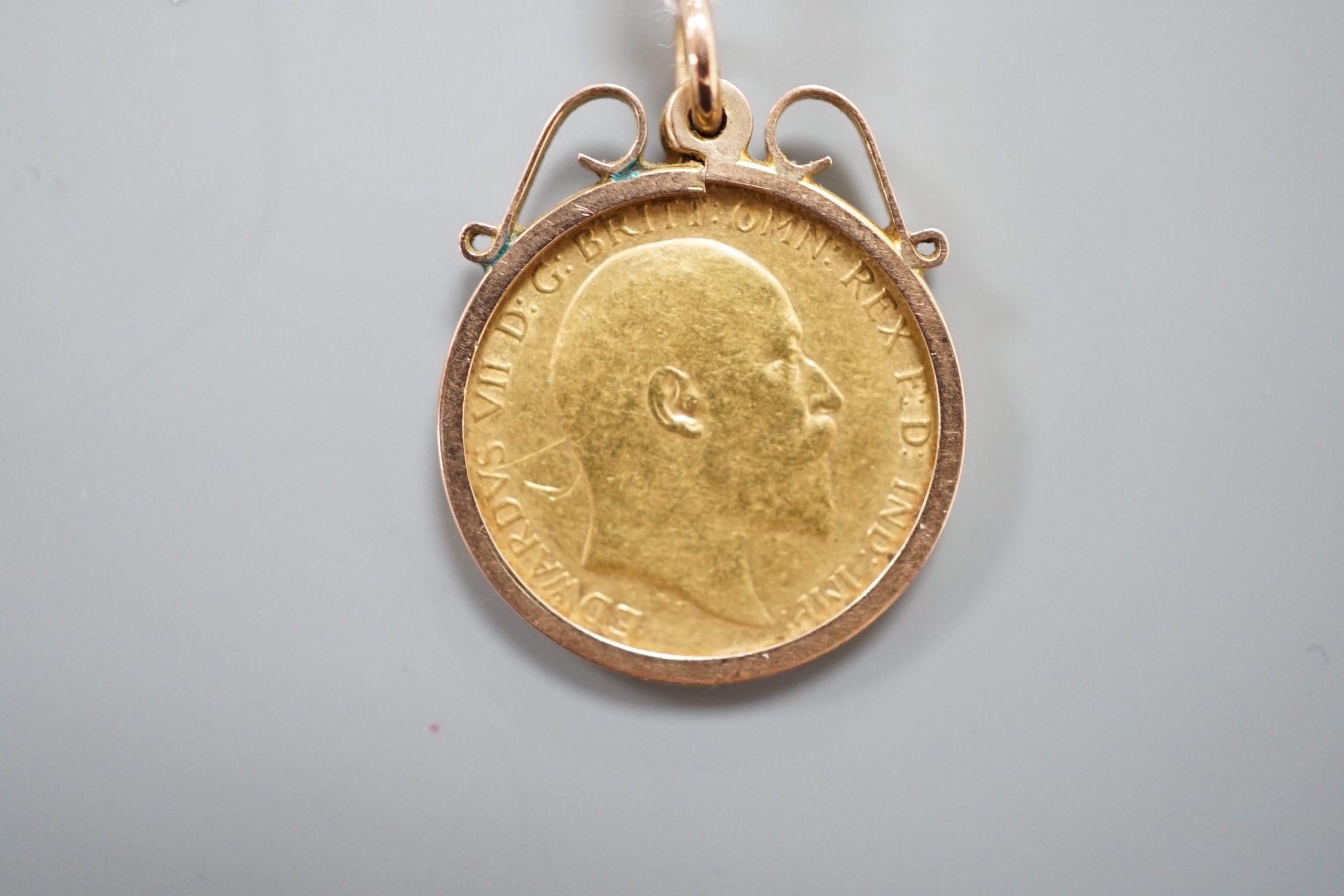 An Edward VII gold half sovereign, now in 9ct pendant mount.